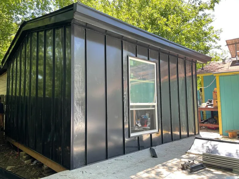 Black standing seam metal wall panels for Roof Inspection in Ferguson