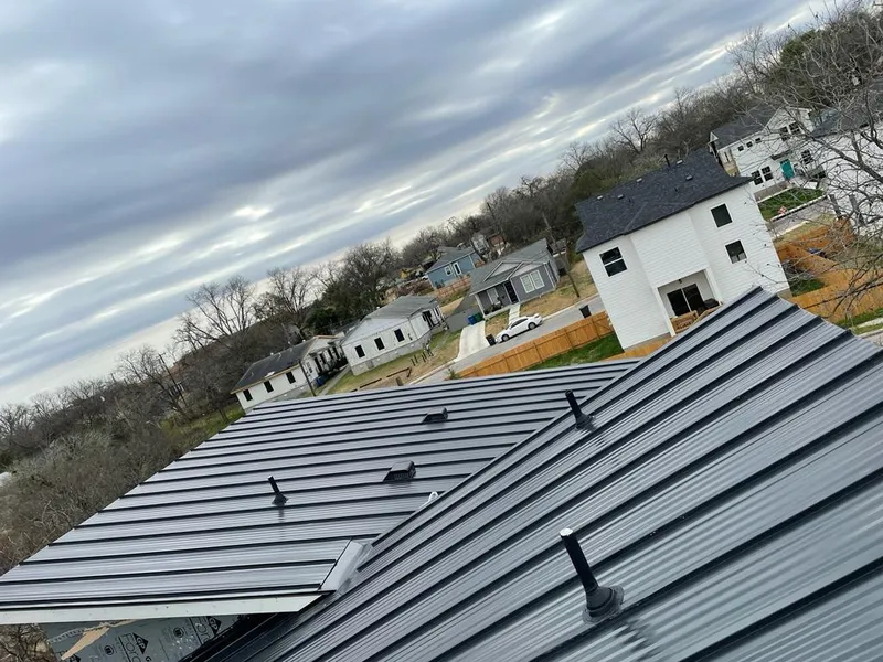Standing seam metal roof panels with vents for Skylight Repair in Ferguson